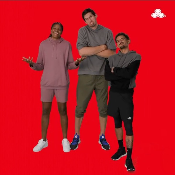 Boban Marjanović with two teammates on a State Farm red backdrop.