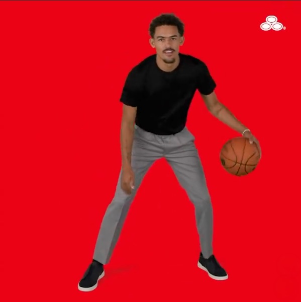 Trae Young dribbling a basketball on a State Farm red backdrop.